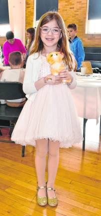 Abigail Drongoski of Sparta holds a plush toy.