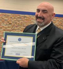 Tomko receives Above and Beyond Award