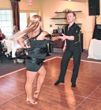 Award-winning dance instructors Olena Shvets Nikishkin and Dmitry Nikishkin dance.