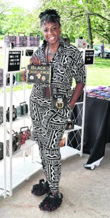 <b>Kim Resteghii of Augusta poses with her bags.</b>
