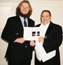 Andrew Kadar, 19, of Sparta, left, prepares for the world premiere of his piece ‘The Sun Rises’ with Hanover Wind Symphony music director and conductor Matthew Paterno of Parsippany. (Photo provided)