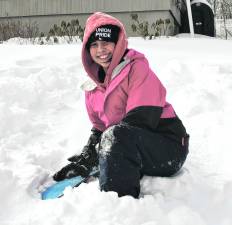 Dalva Garcia of Sparta enjoys the snow on Monday.