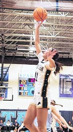 Pope John's Natalija Novkovic rises towards the hoop during a shot.