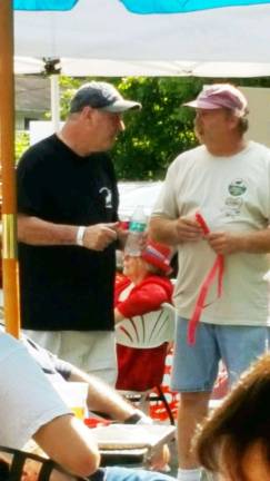 Photos by Laurie Gordon Lodge Administrator Pete Pirmann and Lodge Governor Bill Lunger enjoy the clam bake.