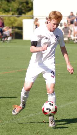 Newton's Josh Faller is about to kick the ball.