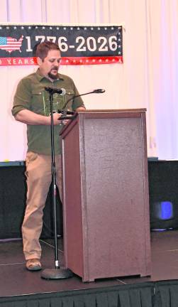 Enterpreneur of the Year Award went to Charles Kuperus, Tire King. Pictured is his son, John Kuperus, who accepted the award on his father's behalf.