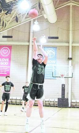 Veritas Christian's Aiden Bennett launches the ball from the foul line in the first half. Bennett scored 3 points.