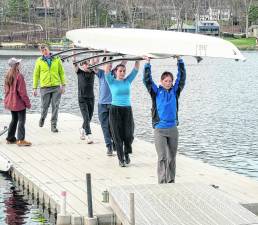 Members of the Sussex County Rowing Club carry a boat away from the water after a recent practice. The club is made up of Students from Sparta High School and Pope John XXIII Regional High School.