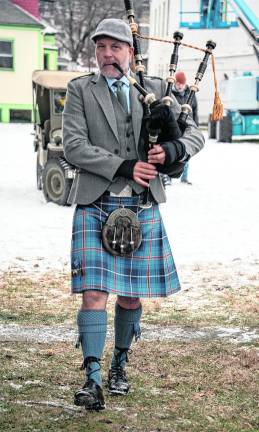 Jeff Korger plays the bagpipes.