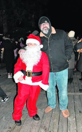 Luciano and Joe Mamiglietti of Sparta pose at the tree lighting.