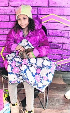 Keniah Cruz of Sparta holds a bunny.