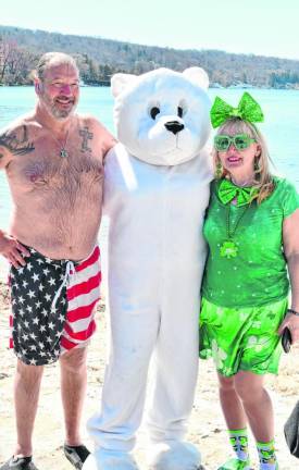 Yosh Hadley, left, and Bobbi Landrock pose with a polar bear.