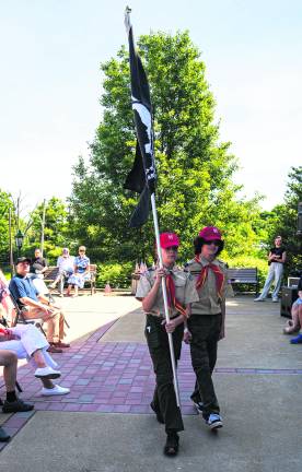 Cub Scouts Leonardo Pilava and noah Bassia bring the flag.
