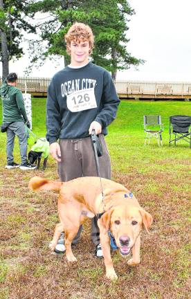 Joe Aldrich poses with his dog, Bear.