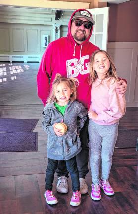 Ella, Brian, Charlotte Foley explore the clubhouse.