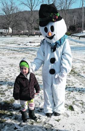 Theodore Gumble is shown with Frosty The Snowman.