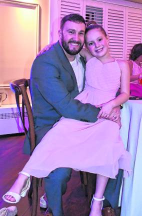 Madison McKowen is with her father, Matt.