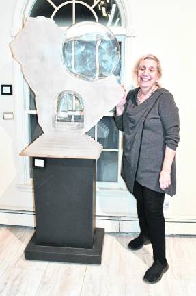 <b>Ailene Fields is shown next to her sculpture, Sanctum Porta Crystal.</b>