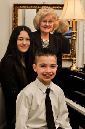 Piano teacher Joan Farrington with her students Maika Batchelor and Tyler Harms Photo provided