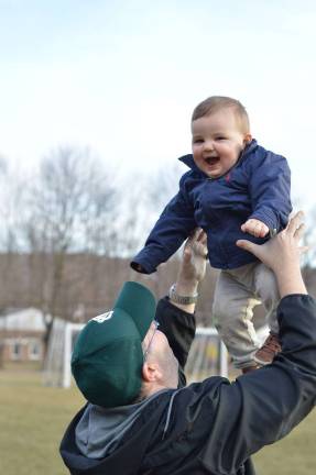 Brian. From serious to so very happy, he is our little lucky charm! Photo courtesy of Brianne.