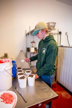 A teen working at Bellvale Farms Creamery in April, 2022. Photo by Sammie Finch.
