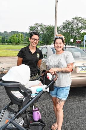 Newton police Detective Sgt. Judy Torres, left, poses with Barbara Hunton of Newton at National Night Out in Newton.