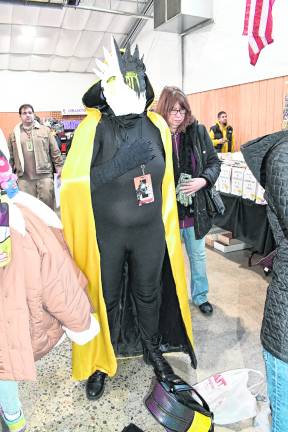 <b>Alicia Bennett of Blairstown dresses in a black and yellow costume.</b>