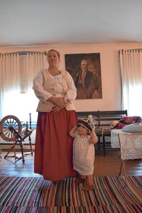 <b>Museum curator Ashley Ziccardi with her daughter, Reagan, 1, wearing a pudding cap.</b>