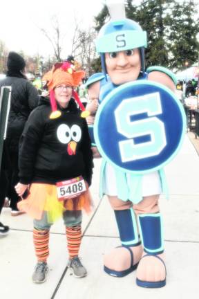 Loretta Lagala of Highland Lakes is shown with the Sparta Township High School mascot.