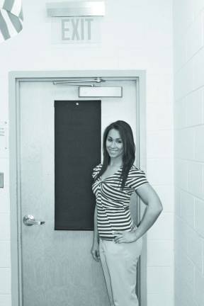 Co-owner Christine M. Bacolas showing the Hideaway Helper on a classroom door