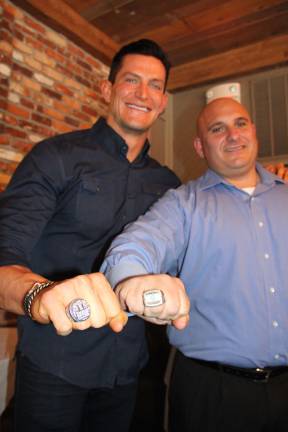 Steve Weatherford and Frank Marchiano showing off their championship rings.