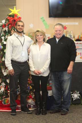 From right to left, Ben Davey from Sussex County DCP&amp;P and Michelle and Paul Wiebel in front of the JWCS Wish Tree located at the Sparta Library.  Donations will be accepted through Dec. 14. (Photo by Jenn Carlson).