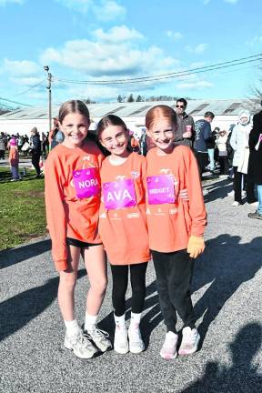 <b>Nora Bowness, Ava Dunbar-Moskowitz and Bridget Digidio, all of Sparta, are shown before the race.</b>