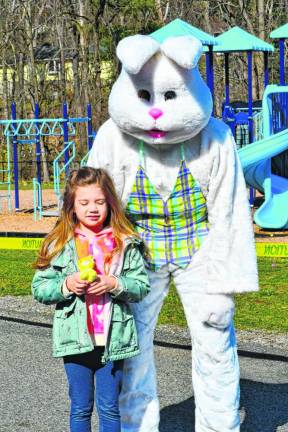 Mackenzie Snyder poses with the Easter Bunny.