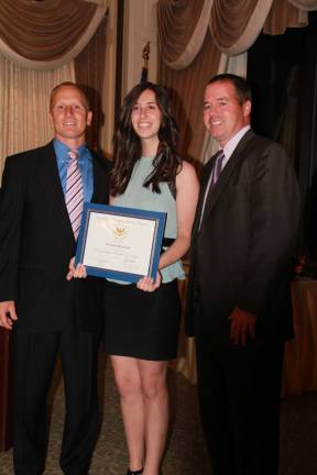 Valedictorian Christine Scaglione receives her certificate from Director of Guidance Rory Fitzgerald and Guidance Counselor Tim Librizzi.