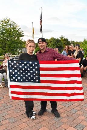Corey and Marko Stankovic of Sparta hold an American flag.