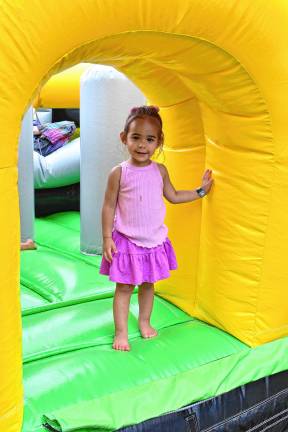 Lottie Galli of Sparta plays in a bounce house at the Sparta Food Truck &amp; Music Fest.