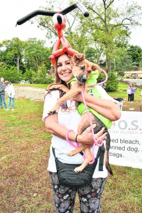 Renee McDonnell holds Pam, a dog available for adoption from One Step Closer Animal Rescue.