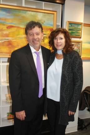 Sparta Municipal Judge Paris Eliadas with his wife Ginny attend Friday’s night’s Retirement Art Show of Maggie Davis-Jelly.