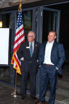 Special Forces Charitable Trust President Terry English (L) and Col. Kent Solheim (Ret.) (R) share a laugh at a fundraiser dinner held in Sparta on Friday, Oct 25, 2019.