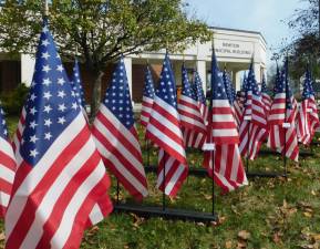 Flags line the lawn of the Newton Municipal Building as part of a Flags of Honor celebration held ahead of Veterans Day on Saturday, Nov 9, 2019.