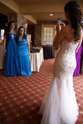 Keren Santos snaps a photo of Breanna Vitolo and Ashley Darnsteadt.
