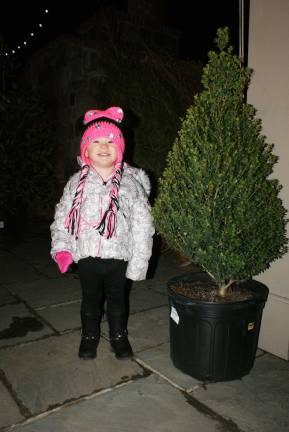 Emma Carter, 2 years old, of Sparta, picking out the perfect sized Christmas tree