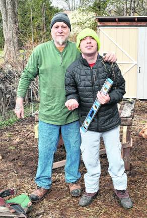<b>Mikey Ferrara, Sr., and Mikey Ferrara, Jr. from Branchville take a break from working.</b>