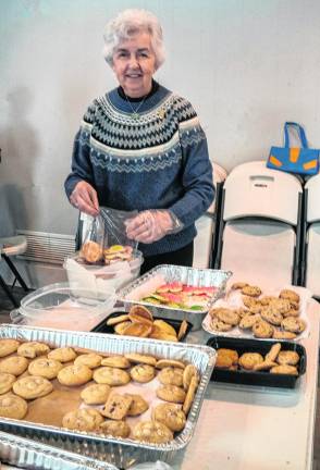 Mary Warner packs cookies.