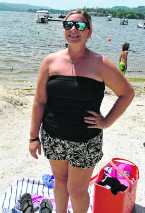 Stephanie Space of Lake Mohawk stands on the beach.