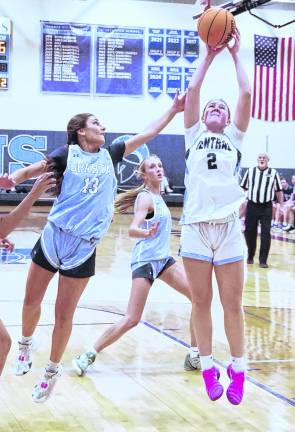 Sparta's Alyssa Ciaburri (13) attempts to block a shot by West Morris Central's Olivia Janke (2) in the second period.