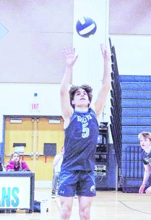 Sparta's George Tsamadias sets a pass. Tsamadias had 5 digs, 14 attacks and 2 aces.
