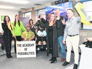 The ribbon is cut, celebrating the opening of The Academy of Possibllities in Sparta.