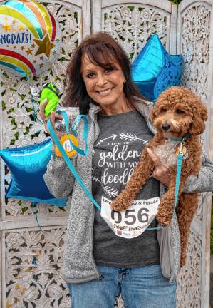 Trish Kronman with Koda, a Cavapoo and winner in the designer dog category.